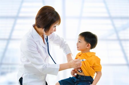 doctor listening boy - Children's doctor exams infant with stethoscope Stock Photo - Budget Royalty-Free & Subscription, Code: 400-06098669