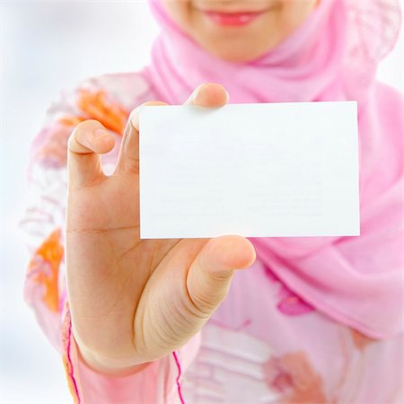 Muslim female holding business card, focus on hand Stock Photo - Budget Royalty-Free & Subscription, Code: 400-06098676