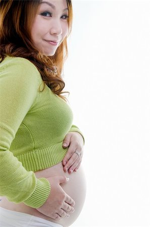 Asian pregnant lady standing on white background Stock Photo - Budget Royalty-Free & Subscription, Code: 400-06098682