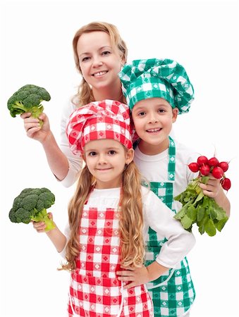 Happy chefs family preparing healthy vegetables meal - isolated Stock Photo - Budget Royalty-Free & Subscription, Code: 400-06098805