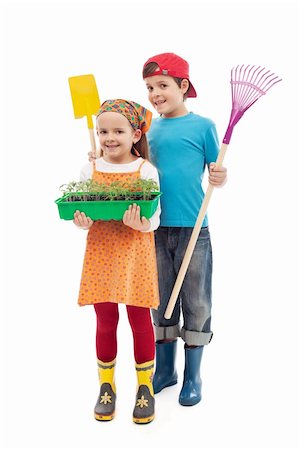 farmer help - Kids ready to plant tomato seedlings in the spring - isolated Stock Photo - Budget Royalty-Free & Subscription, Code: 400-06098829