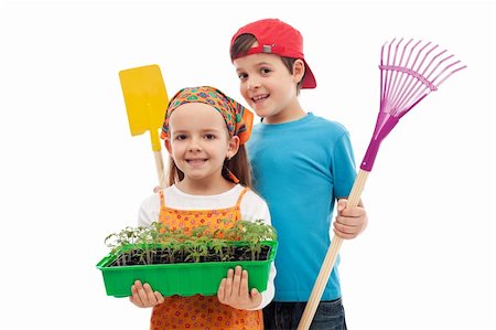 farmer help - Kids with spring seedlings and gardening tools - isolated Stock Photo - Budget Royalty-Free & Subscription, Code: 400-06098830