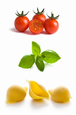 plain pasta - conchiglioni pasta shells, tomatoes and basil leaves isolated Stock Photo - Budget Royalty-Free & Subscription, Code: 400-06099238