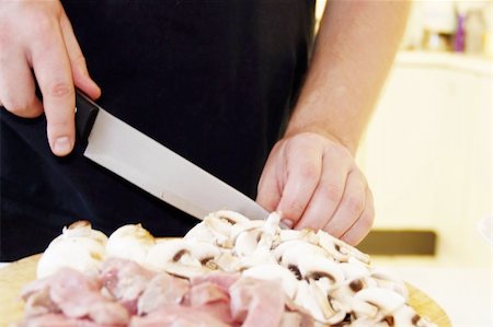 simsearch:400-07713408,k - Man is cutting meat and mushrooms for beef Stroganoff Stock Photo - Budget Royalty-Free & Subscription, Code: 400-06099659