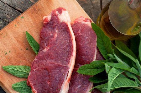 Raw meat with fresh vegetables and rosemary Stock Photo - Budget Royalty-Free & Subscription, Code: 400-06090187
