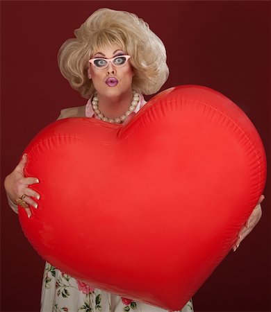 funny wig woman - Shocked drag queen with heart shaped balloon Stock Photo - Budget Royalty-Free & Subscription, Code: 400-06090221