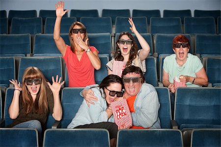 people scared movie theatre - Group of emotional people with 3D glasses in a theater Stock Photo - Budget Royalty-Free & Subscription, Code: 400-06090243