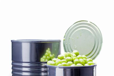 enlatar - Close-up photograph of green peas in a can on a white background. Foto de stock - Super Valor sin royalties y Suscripción, Código: 400-06090374