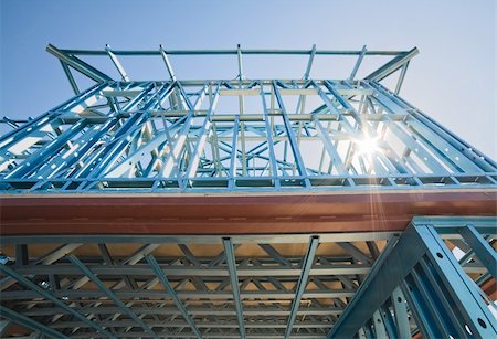 simsearch:400-05344387,k - New home under construction using steel frames against a sunny sky. Stock Photo - Budget Royalty-Free & Subscription, Code: 400-06091608