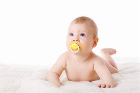 funny baby surprised expression - child with dummy on the floor Stock Photo - Budget Royalty-Free & Subscription, Code: 400-06091724