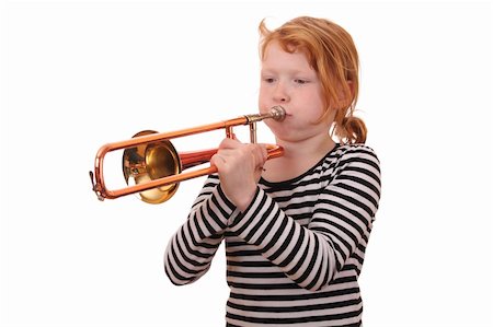 Young girl playing a trombone on white background Stock Photo - Budget Royalty-Free & Subscription, Code: 400-06092004