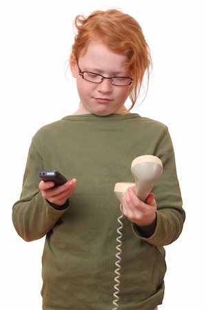 Young girl with cell phone and old phone Stock Photo - Budget Royalty-Free & Subscription, Code: 400-06092017