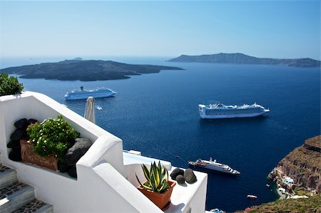 flowers greece - City of Santorini, built terraces. So proud of the street, it is almost always below the roofs of houses standing. Stock Photo - Budget Royalty-Free & Subscription, Code: 400-06092038