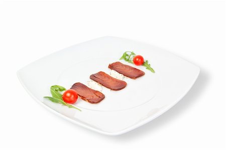 The composition of smoked tuna on a plate. On a white background. Photographie de stock - Aubaine LD & Abonnement, Code: 400-06092286