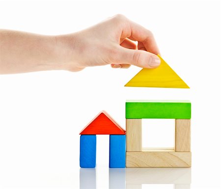 Wooden block houses under construction isolated on white background Stock Photo - Budget Royalty-Free & Subscription, Code: 400-06092296