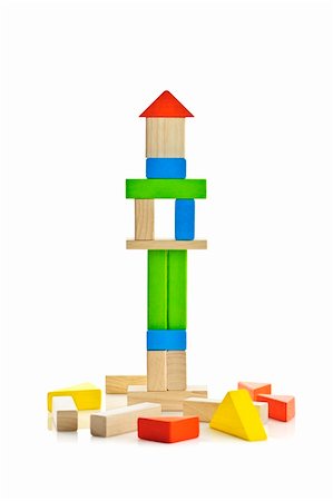 Tower of wooden building block toys isolated on white background Stock Photo - Budget Royalty-Free & Subscription, Code: 400-06092297