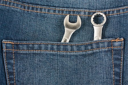 stitching tools - Two wrenches in the pocket of blue jeans Stock Photo - Budget Royalty-Free & Subscription, Code: 400-06092418