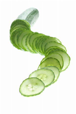 defocus - Focus play with a cucumber slices on white Stock Photo - Budget Royalty-Free & Subscription, Code: 400-06092579