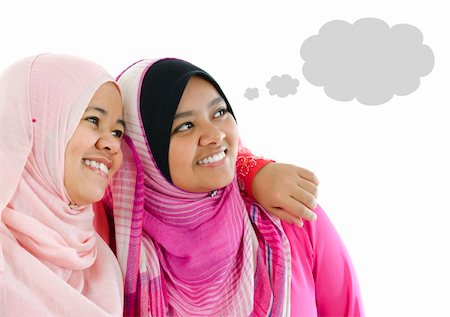 simsearch:400-06142860,k - Two Muslim women having thought together, looking at side Fotografie stock - Microstock e Abbonamento, Codice: 400-06092792