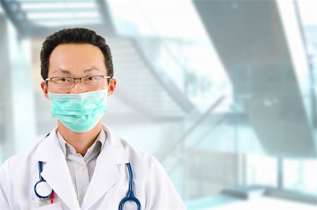 person suit hospital - Asian male doctor with face mask portrait standing inside hospital building Stock Photo - Budget Royalty-Free & Subscription, Code: 400-06092809