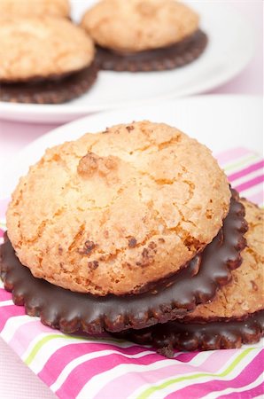 Homemade Coconut Cookies With Chocolate on White Plate Foto de stock - Super Valor sin royalties y Suscripción, Código: 400-06093040