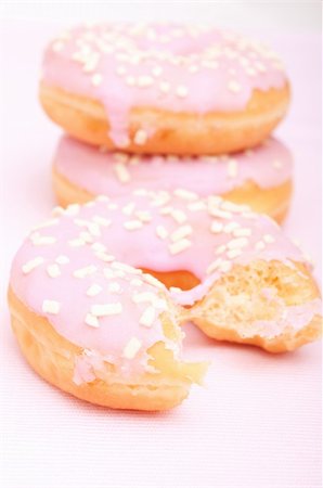 simsearch:400-06524508,k - Closeup of Homemade Donuts with Pink Icing - Shallow Depth of Field Stock Photo - Budget Royalty-Free & Subscription, Code: 400-06093757