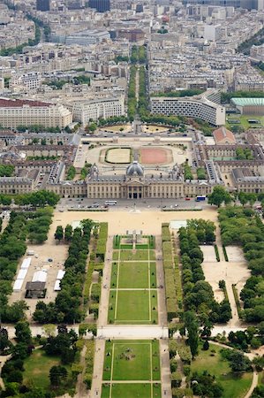 simsearch:400-08165894,k - Beautiful aerial view of Champ de Mars in Paris, France. This is a large public greenspace in Paris, France, located in the seventh arrondissementnext to Eiffel Tower. The park is named after the Campus Martius in Rome, a tribute to the Roman god of war. Useful file for your brochure about Paris, France and European culture. Foto de stock - Super Valor sin royalties y Suscripción, Código: 400-06104056