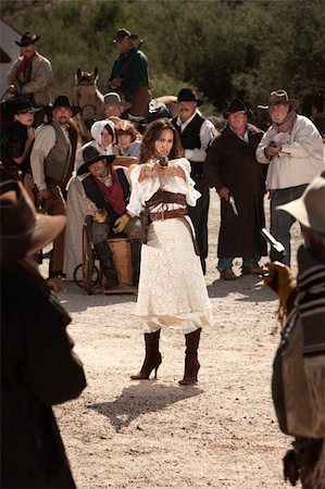 Sexy Latina woman in western outfit with pistol Stock Photo - Budget Royalty-Free & Subscription, Code: 400-06104092