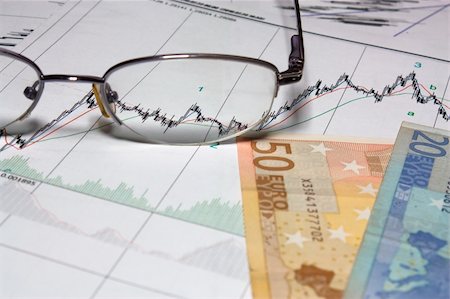 Glasses and Euro on graph of charts. Stock Photo - Budget Royalty-Free & Subscription, Code: 400-06104379