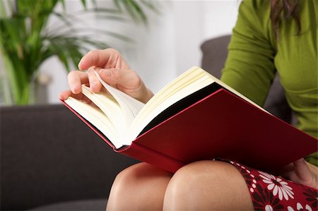 woman detail sitting on a brown sofa reading a book Stock Photo - Budget Royalty-Free & Subscription, Code: 400-06104394
