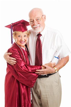 Senior woman graduating from college, standing with her proud, supporting husband.  Isolated on white. Stock Photo - Budget Royalty-Free & Subscription, Code: 400-06104524