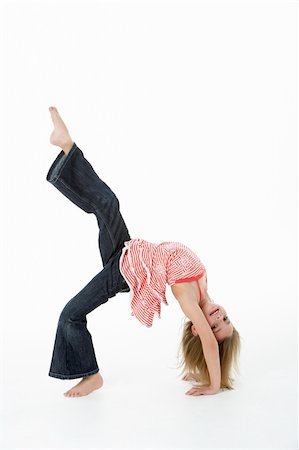 Young Girl Doing Backflip In Studio Stock Photo - Budget Royalty-Free & Subscription, Code: 400-06104846