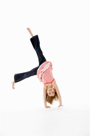 Young Girl In Gymnastic Pose Doing Cartwheel Stock Photo - Budget Royalty-Free & Subscription, Code: 400-06104841