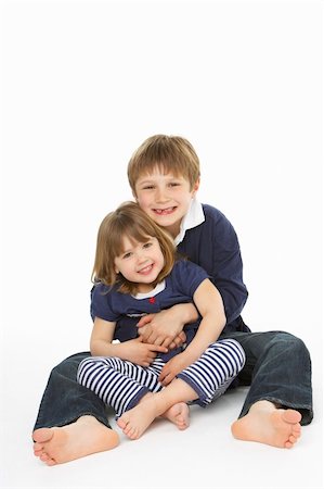 Studio Portrait Of Happy Brother And Sister Stock Photo - Budget Royalty-Free & Subscription, Code: 400-06104925