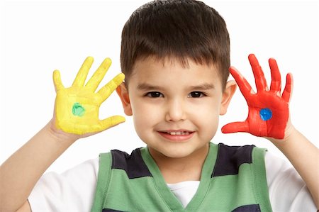 Studio Portrait Of Young Boy With Painted Hands Stock Photo - Budget Royalty-Free & Subscription, Code: 400-06104987