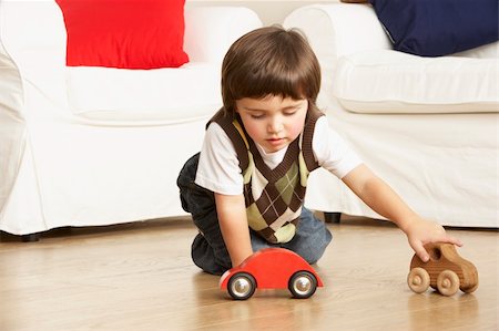 Young Boy Playing With Toy Cars At Home Stock Photo - Budget Royalty-Free & Subscription, Code: 400-06104996