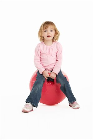 Young Girl Having Fun On Inflatable Hopper Stock Photo - Budget Royalty-Free & Subscription, Code: 400-06104997