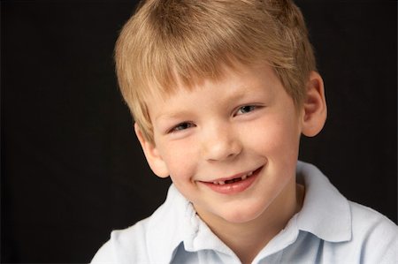 Studio Portrait Of Smiling Boy Stock Photo - Budget Royalty-Free & Subscription, Code: 400-06105050
