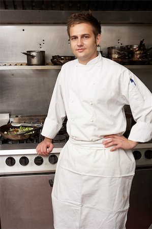 simsearch:400-06105151,k - Male Chef Standing Next To Cooker In Restaurant Kitchen Foto de stock - Super Valor sin royalties y Suscripción, Código: 400-06105165