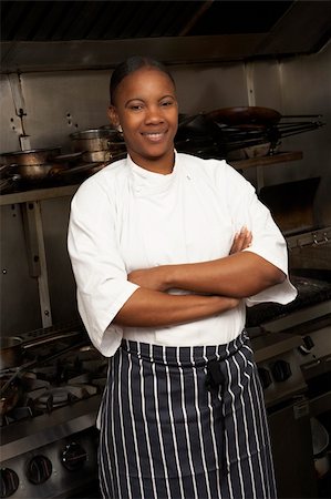 simsearch:400-06105151,k - Female Chef Standing Next To Cooker In Restaurant Kitchen Foto de stock - Super Valor sin royalties y Suscripción, Código: 400-06105168