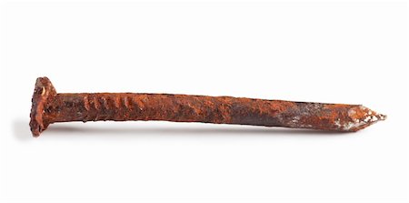 rusty tools - Macro view of rusty nail over white background Stock Photo - Budget Royalty-Free & Subscription, Code: 400-06105294