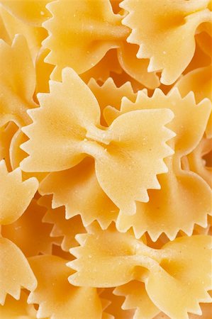 Closeup view of dried bow shaped macaroni Stock Photo - Budget Royalty-Free & Subscription, Code: 400-06105290