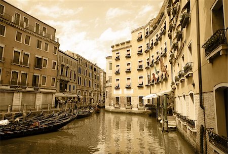 simsearch:400-06391540,k - Venetian canal. The walls of old buildings. On the water, the gondola is. Imitation of antiques Stock Photo - Budget Royalty-Free & Subscription, Code: 400-06105334