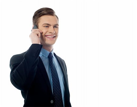 simsearch:400-04963726,k - Handsome business executive communicating on cellphone against white background Stock Photo - Budget Royalty-Free & Subscription, Code: 400-06105374