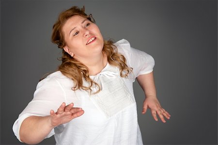 simsearch:400-07305387,k - dancing fat woman on gray background Photographie de stock - Aubaine LD & Abonnement, Code: 400-06106267