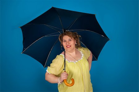 simsearch:400-07305387,k - Cute fat woman holding umbrella Photographie de stock - Aubaine LD & Abonnement, Code: 400-06106273