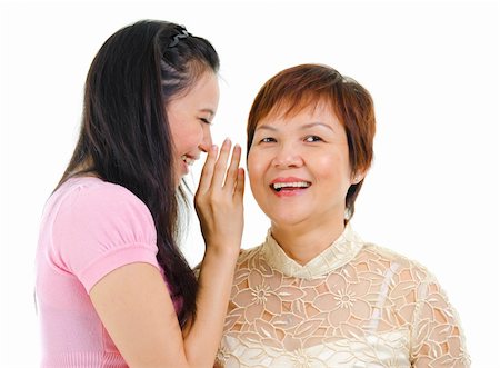 Young Asian daughter talking secretly to her mum Photographie de stock - Aubaine LD & Abonnement, Code: 400-06107317