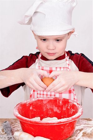 simsearch:400-06078465,k - boy in chef hat knead the dough Stock Photo - Budget Royalty-Free & Subscription, Code: 400-06107612