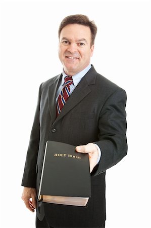 Christian businessman, minister, or missionary, holding a bible.  Isolated on white. Stock Photo - Budget Royalty-Free & Subscription, Code: 400-06108297