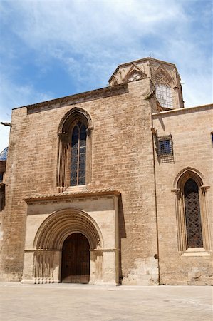 Cathedral-Basilica of the Assumption of Our Lady of Valencia, view from Almoina Square. The Cathedral was built between 1252 and 1482 on the site of a mosque and previosly a roman temple dedicated to Diana. The external architecture is composed of many different styles. Stock Photo - Budget Royalty-Free & Subscription, Code: 400-06108353